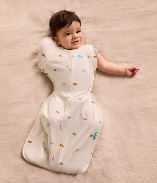 Swaddle Up™ 2-in-1 Übergangspucksack 1.0 TOG Baumwolle Creme Dino-Schnarch