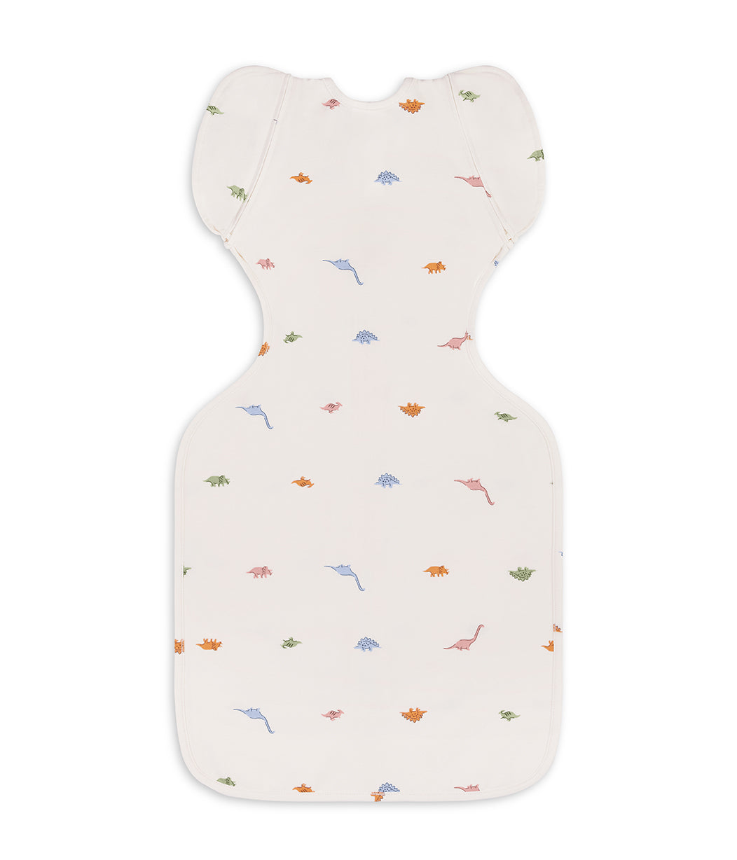 Swaddle Up™ 2-in-1 Übergangspucksack 1.0 TOG Baumwolle Creme Dino-Schnarch